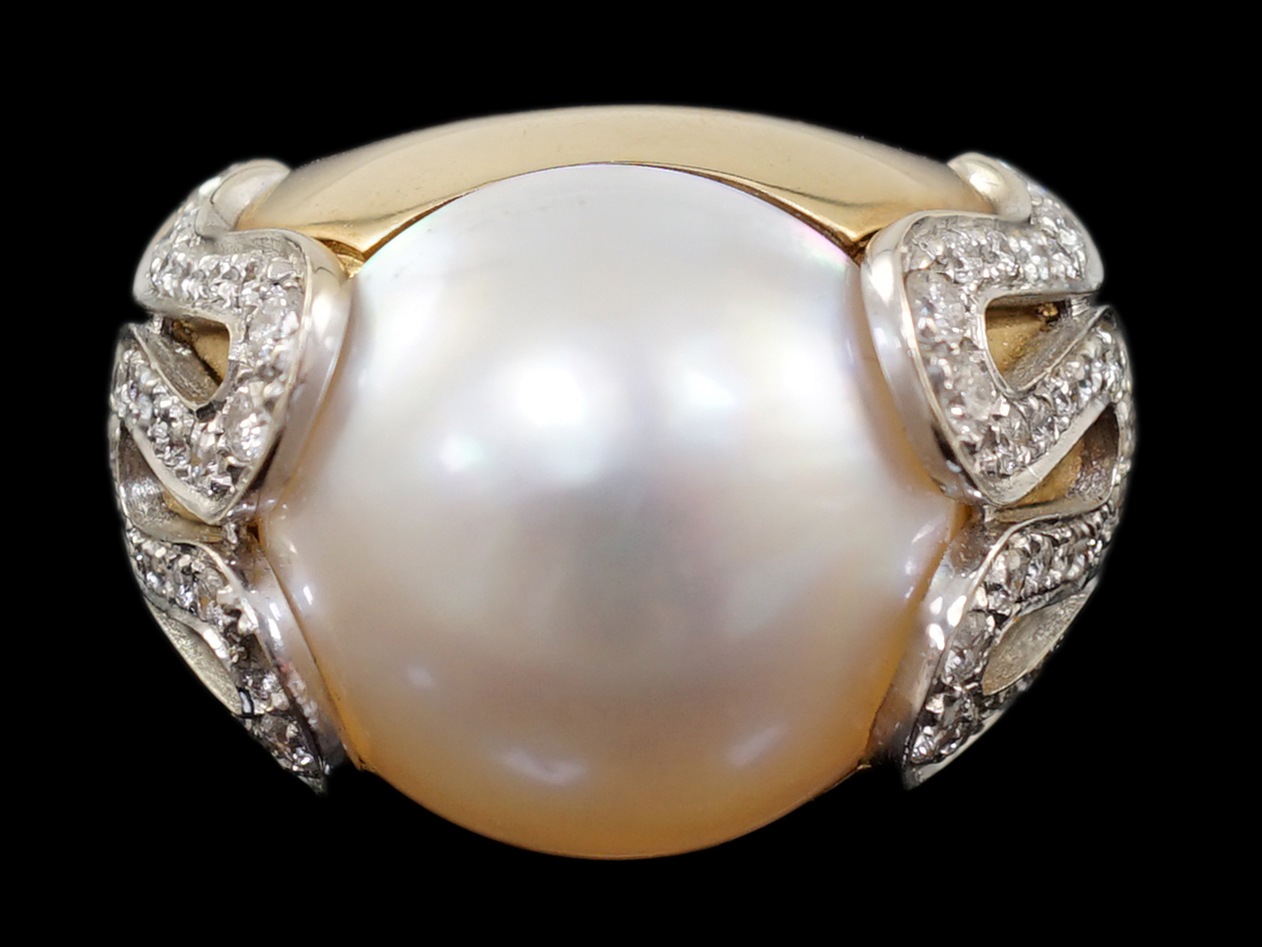 A modern Italian Versace 18ct gold and half cultured pearl set dress ring, with round brilliant cut diamond set shoulders